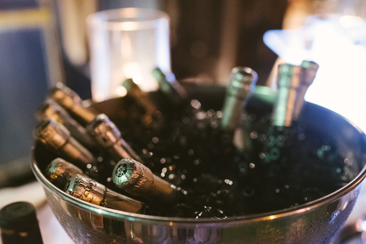 Champagne bottles chilled in a silver bucket for an evening celebration